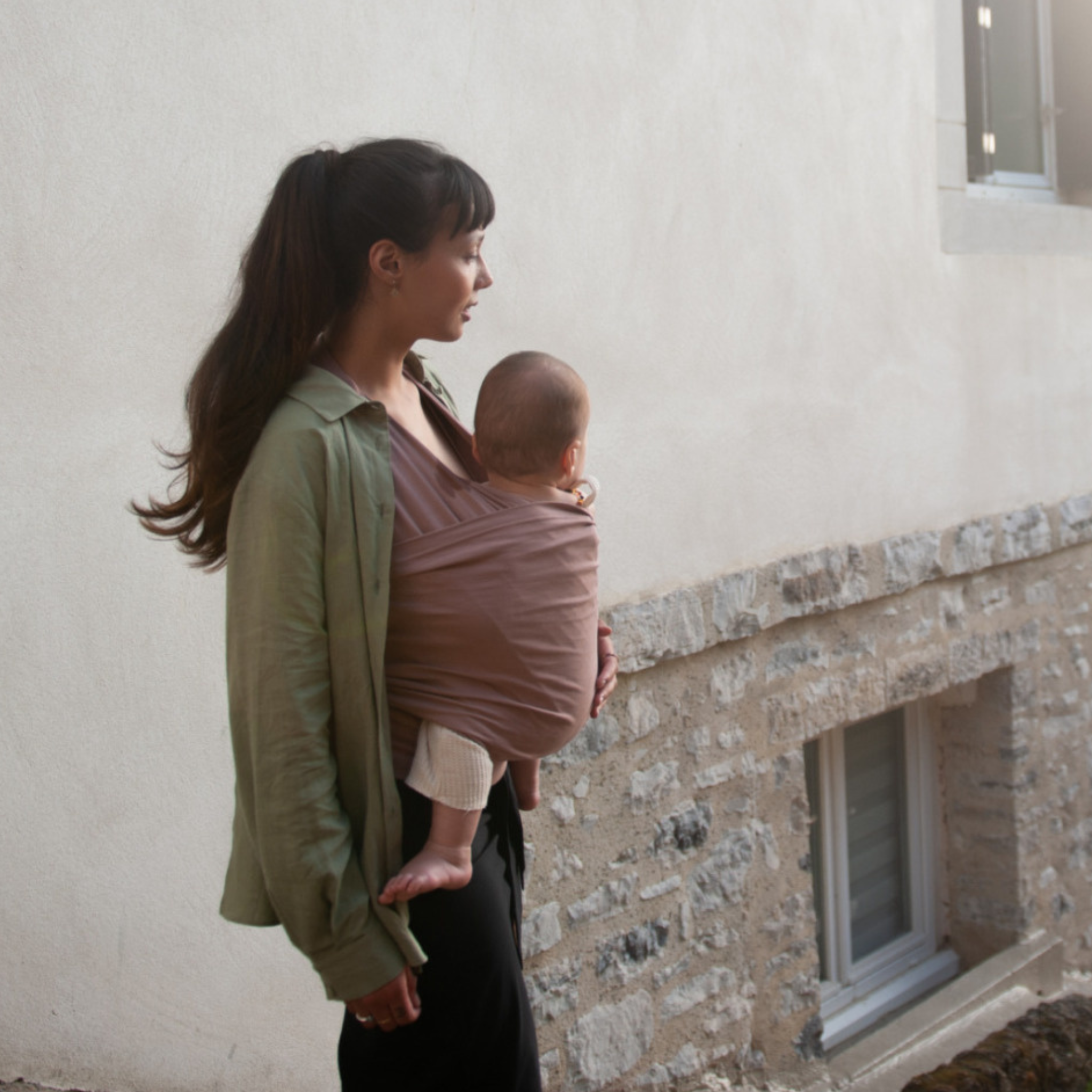 Mama hangs baby carriers